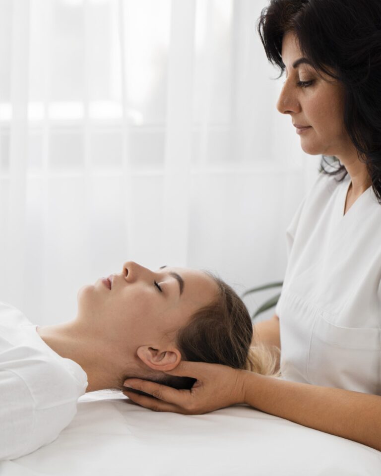 osteopathist treating patient indoors scaled 1