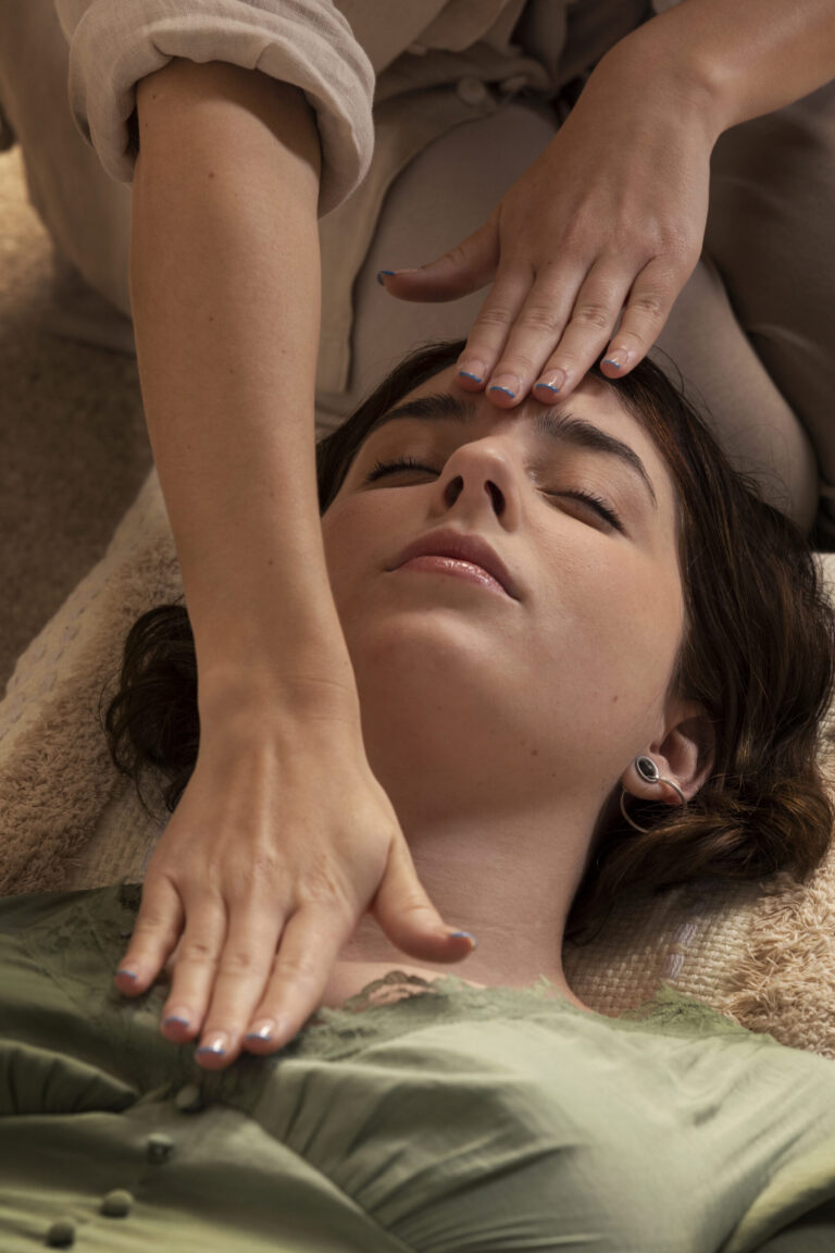 person conducting reiki therapy scaled 1